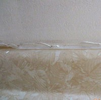 Removing caulk from drywall behind backsplash